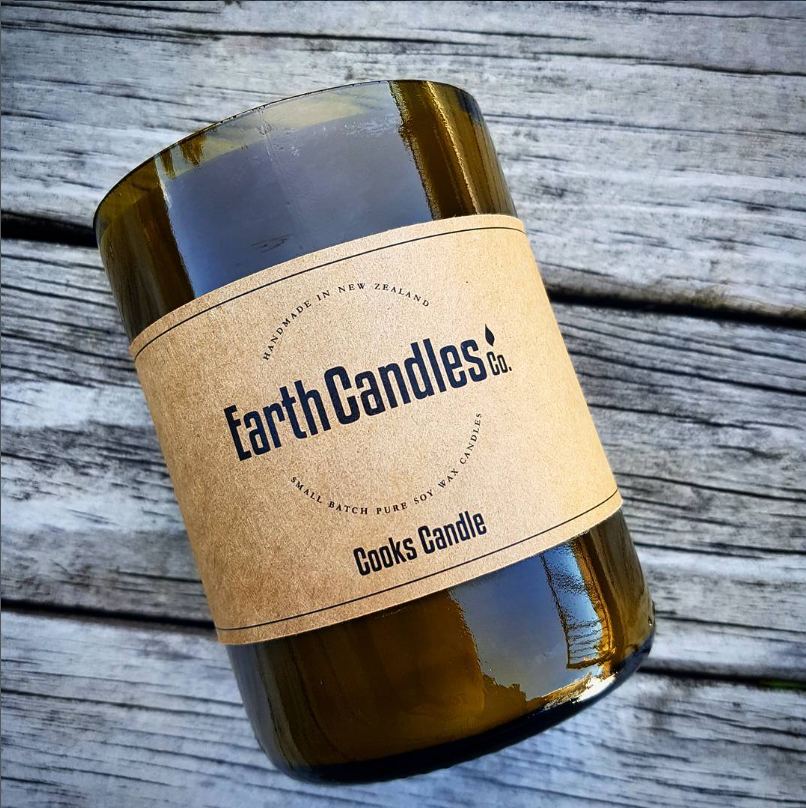 An early Cooks Candle in an upcycled wine bottle, with the original Earth Candles Co. label.