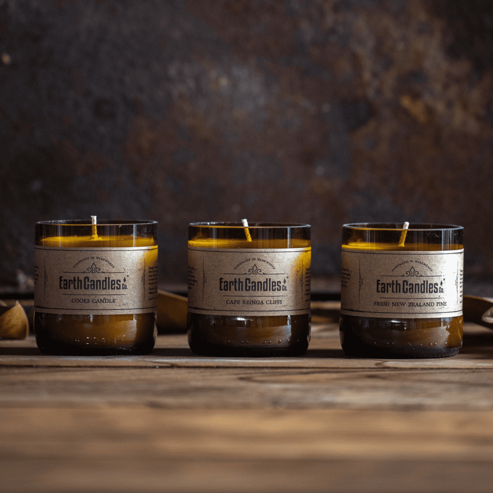 Three Earth Candles Co. soy tealights in cut amber beer bottle bases: Cooks Candle, Cape Reinga Cliffs and Fresh New Zealand Pine